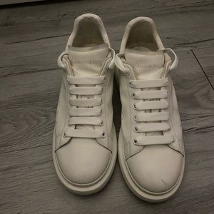 White Alexander Mcqueens size 9 it only has a scuff that can be fixed easily